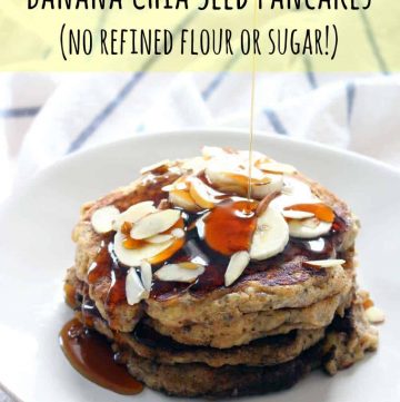 Stack of 3 pancakes on a white plate, topped with sliced almonds and bananas. Maple syrup drizzles on pancakes from above, and overlaid text reads "Banana Chia Seed Pancakes (no refined flour or sugar!)"
