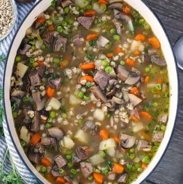 Overhead photo of a Dutch oven with beef barley soup.