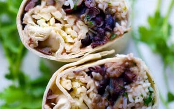 Easy vegetarian burritos with beans, rice, and cheese that can be made ahead of time and frozen for a quick and easy lunch on the go!