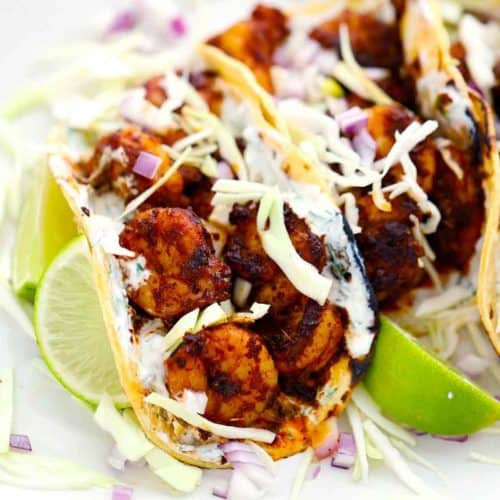 Square photo of shrimp tacos.