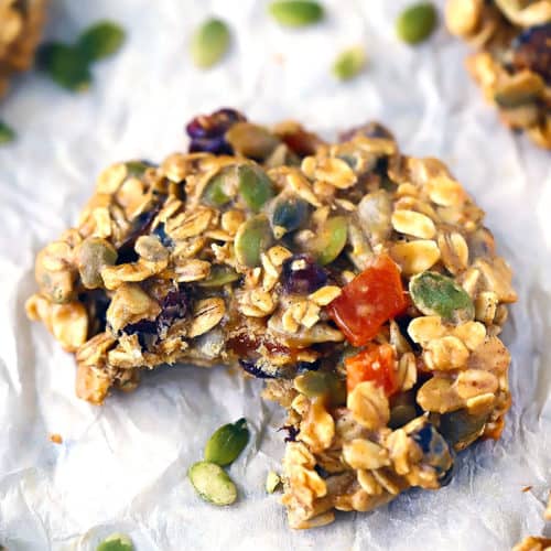 A close up photo of a breakfast cookie with a bite taken out.