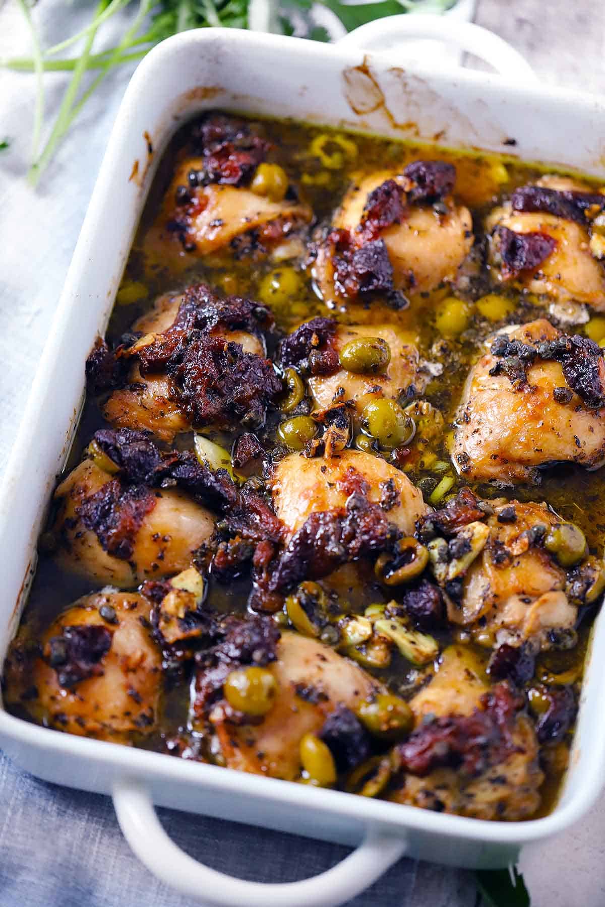 Chicken Marbella in a baking dish after cooking.