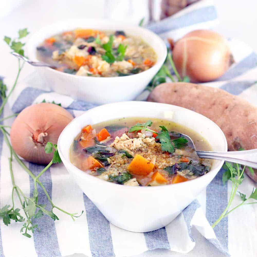 This Chicken Soup with Quinoa, Sweet Potatoes, and Greens is warm, cozy, delicious, and packs a huge nutritional punch. It's gluten free, freezable, and inexpensive to make, and it only takes about 30 minutes to throw together!