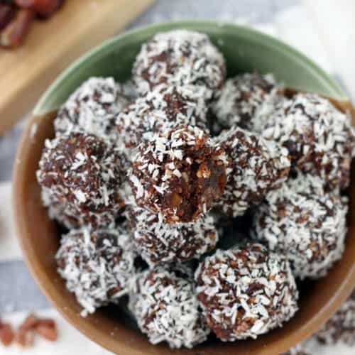 These Whole30 / Paleo chocolate coconut energy balls are an amazing midday snack and energy boost! Sweetened only with dates and super easy to make, they taste decadent, similar to an almond joy, but are 100% guilt-free.
