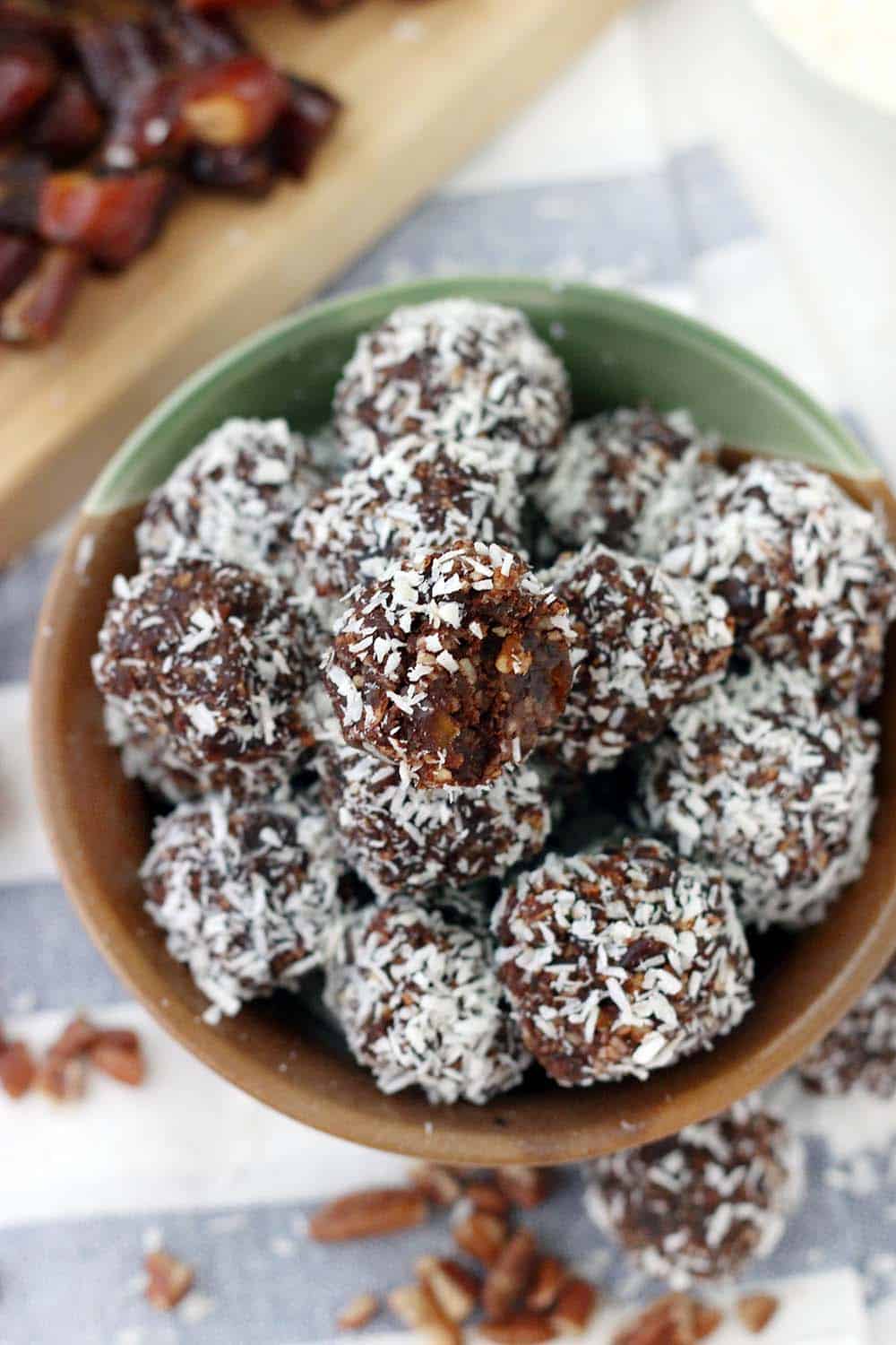 These Whole30 / Paleo chocolate coconut energy balls are an amazing midday snack and energy boost! Sweetened only with dates and super easy to make, they taste decadent, similar to an almond joy, but are 100% guilt-free.