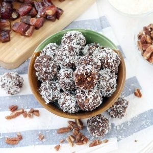 These Whole30 / Paleo chocolate coconut energy balls are an amazing midday snack and energy boost! Sweetened only with dates and super easy to make, they taste decadent, similar to an almond joy, but are 100% guilt-free.