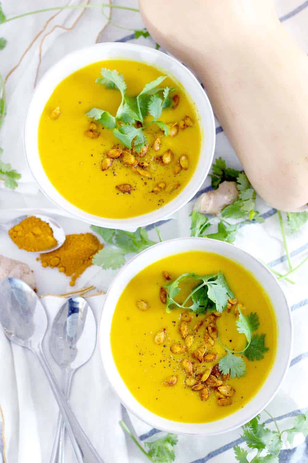 This Ginger Turmeric Butternut Squash Soup is full of healing, healthy ingredients. It's warm, deliciously bright, vegan, low carb, Paleo, and Whole30 compliant!