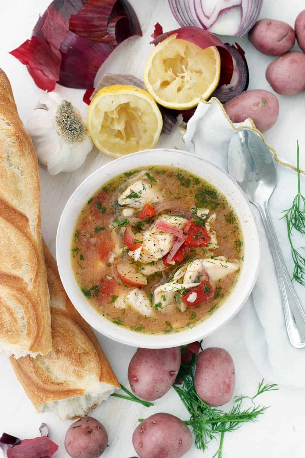 This Instant Pot Fish Stew is a delicious Mediterranean recipe year-round. It features sea bass, potatoes, and tomatoes, and it's flavored with fresh lemon juice, dill, and extra-virgin olive oil. It only takes 20 minutes to make in a pressure cooker!
