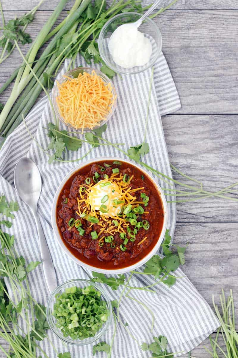Instant Pot Pumpkin Chili is so easy to make and packed with fall flavors from pumpkin pie spices and apple cider! This recipe uses a whole can of pumpkin and is slightly sweet, slightly spicy, and tastes smooth and velvety.