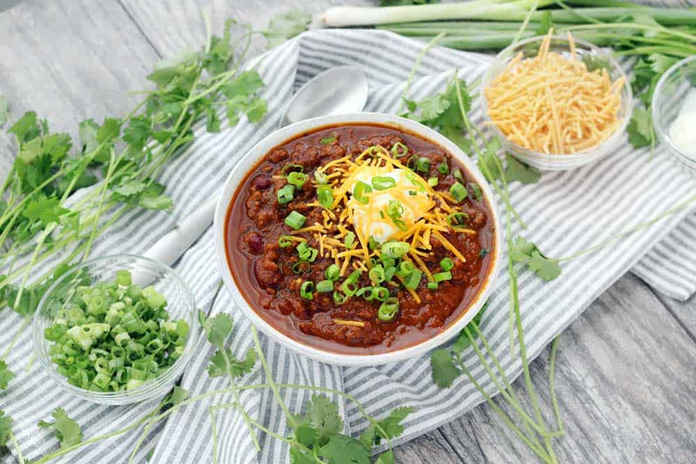 Instant Pot Pumpkin Chili is so easy to make and packed with fall flavors from pumpkin pie spices and apple cider! This recipe uses a whole can of pumpkin and is slightly sweet, slightly spicy, and tastes smooth and velvety.