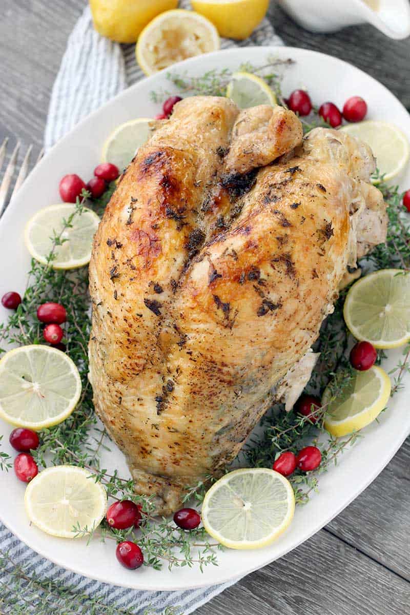 This Instant Pot Turkey Breast with Lemon and Thyme is a Thanksgiving game changer! Cook the whole thing in under an hour for juicy, tender bone-in, skin-on turkey breast.