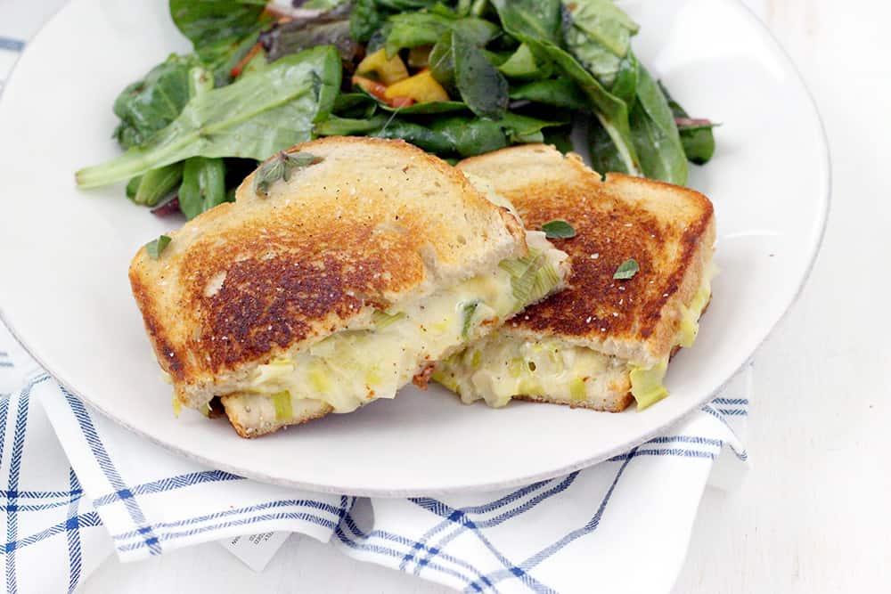 This Leek and Gruyere Grilled Cheese recipe is rich and buttery. Every bite is infused with perfectly melted cheese and that subtle, savory, onion flavor leeks are known for. The perfect easy weeknight dinner with a simple salad or light soup!
