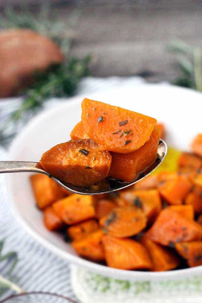 These Glazed Sweet Potatoes are coated in a mixture of melted butter, fresh rosemary, and maple syrup, then baked in the oven until super tender. They're not too sweet, and they're the perfect vegetarian, gluten-free side dish!
