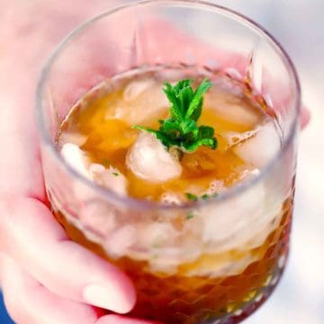 Square photo of a mint julep.