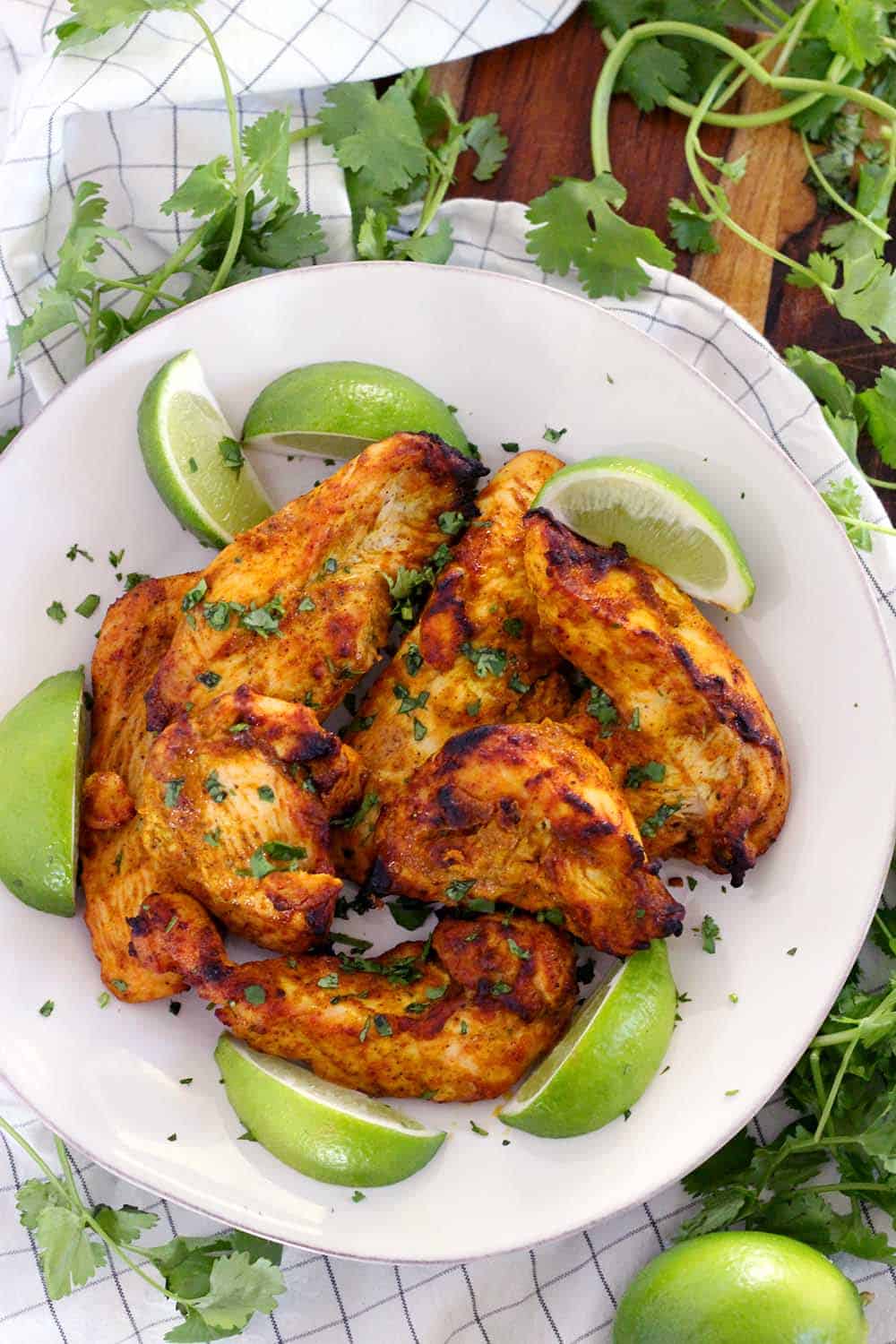 This Oven Broiled Tandoori Chicken is super flavorful, charred, and smoky- just like at your favorite Indian restaurant! This healthy, low carb recipe takes only 20 minutes to cook and is perfect on its own or in your favorite Indian chicken dish.