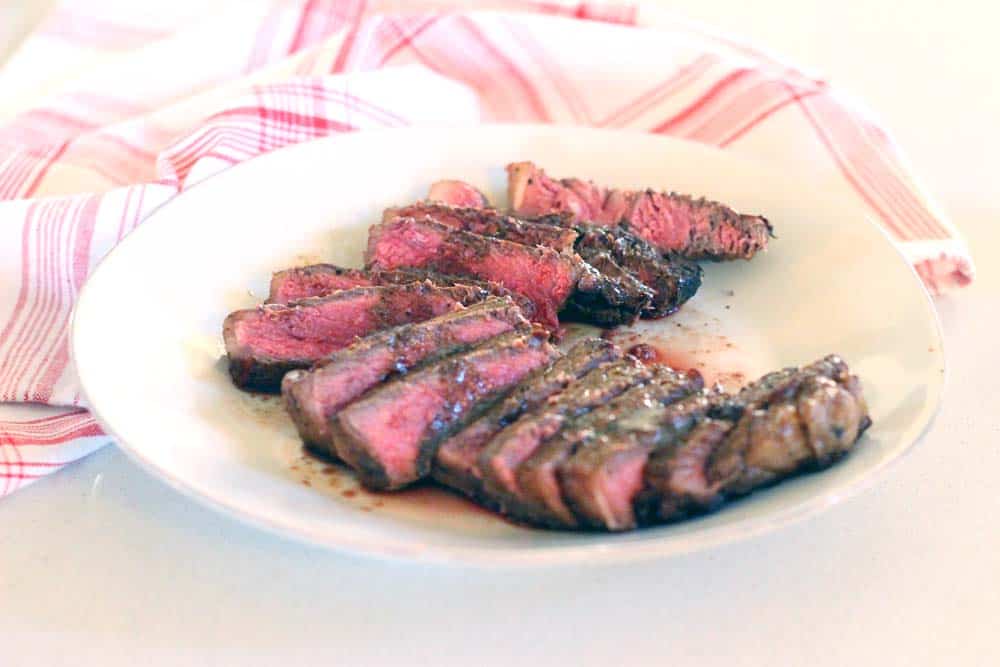 Make the most PERFECT tender, melt-in-your-mouth steak with these 9 easy steps/tricks, with a rich browned butter pan sauce drizzled on top. Paleo and Whole30 approved!