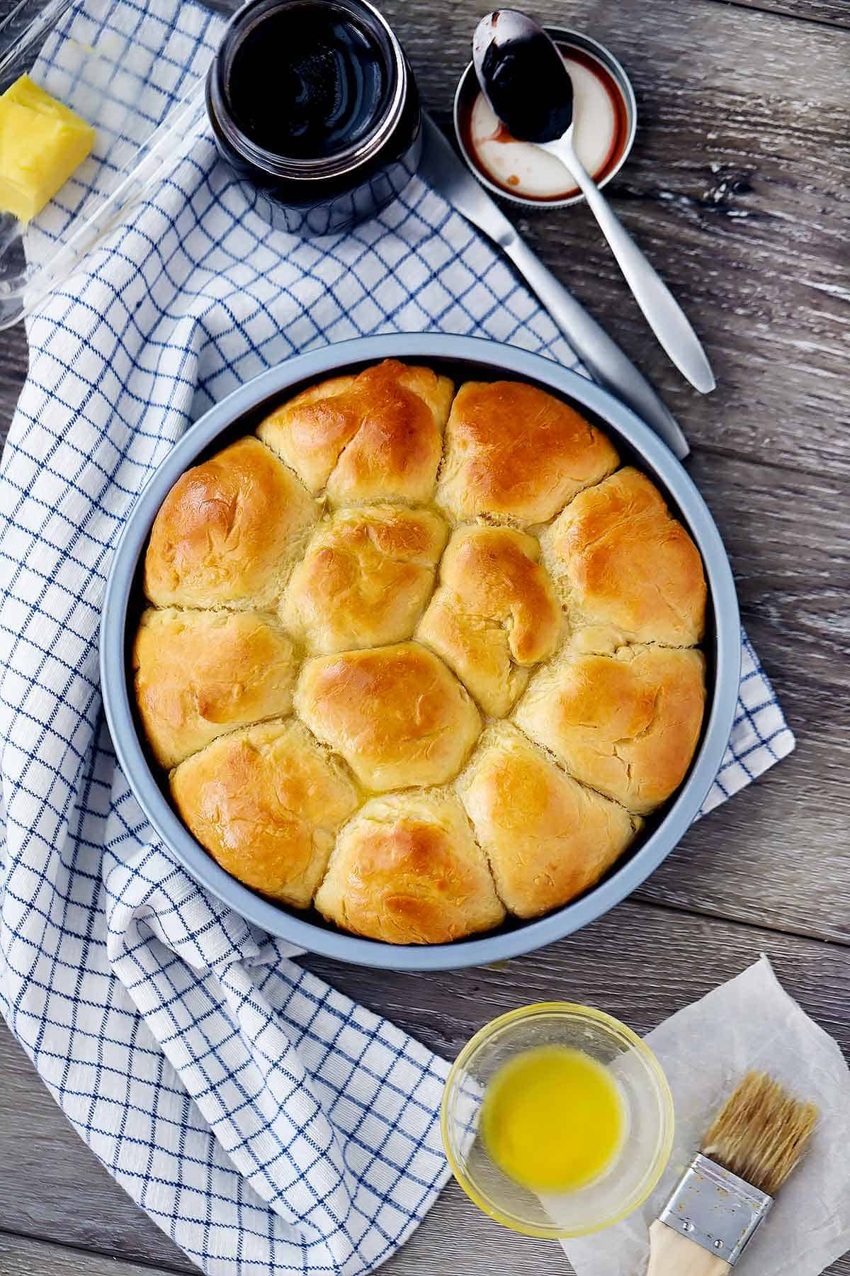 Overhead photo of quick and easy pull-apart dinner rolls in a round pan.