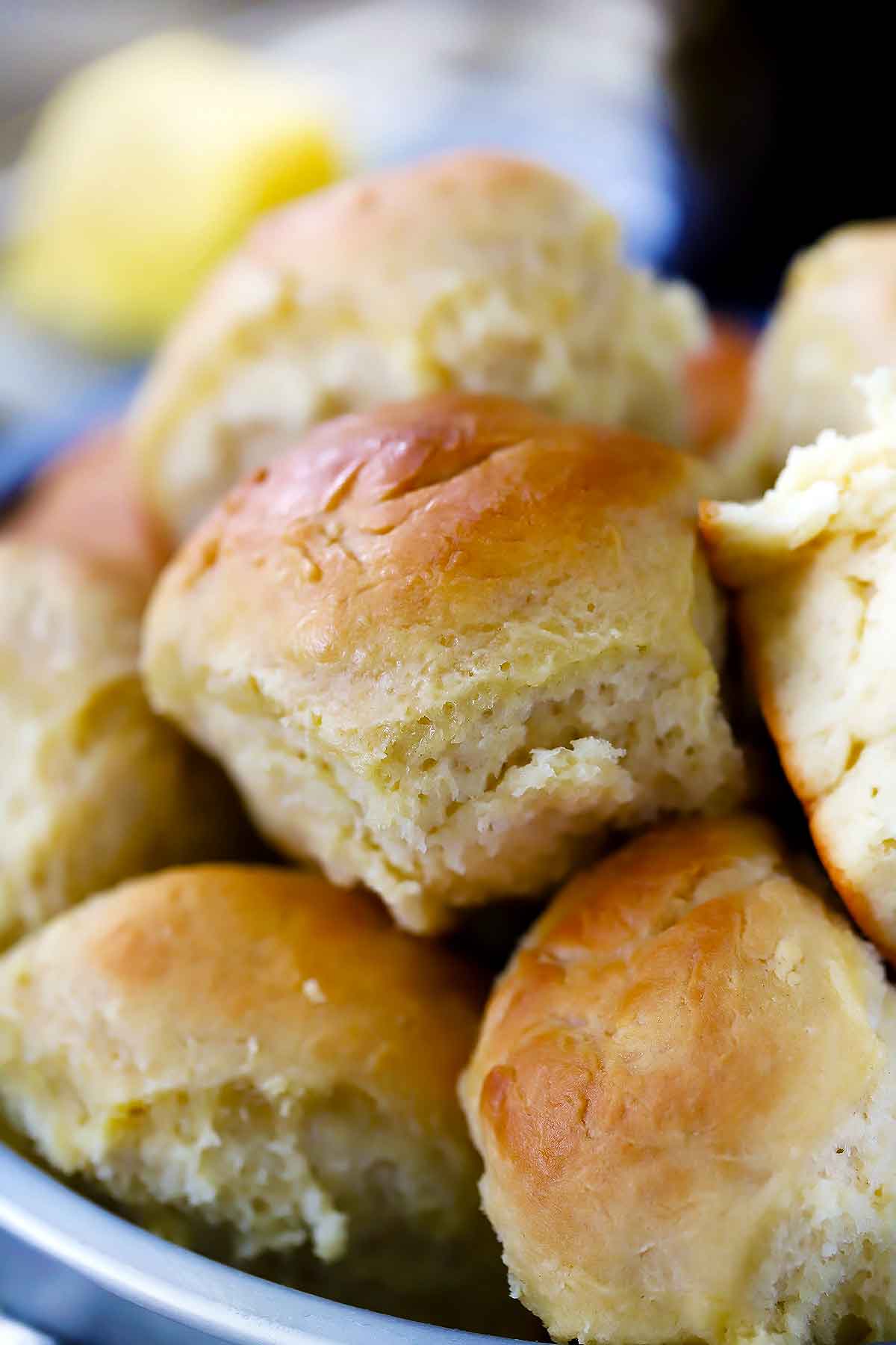 A plate stacked with pull-apart dinner rolls.