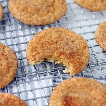 These Pumpkin Spice Snickerdoodles have warming pumpkin pie spices in the batter and are rolled in a mixture of brown and white sugars with cinnamon and more pumpkin pie spice! There's NO actual pumpkin used in this recipe. Make in bulk and keep in your freezer for a fun fall treat!
