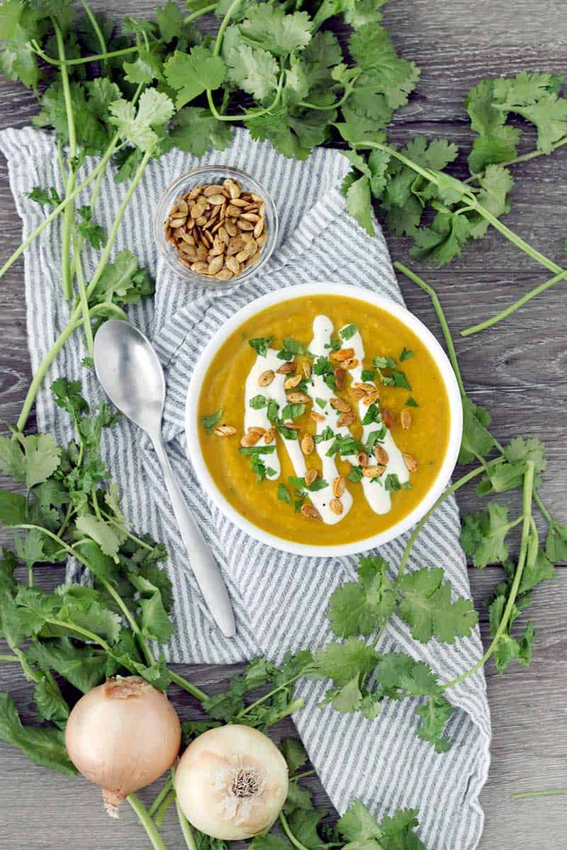 This slow cooker butternut squash soup is packed with flavor from curry, ginger, and other spices like turmeric. It's vegan, super creamy, and paleo/whole30 compliant!