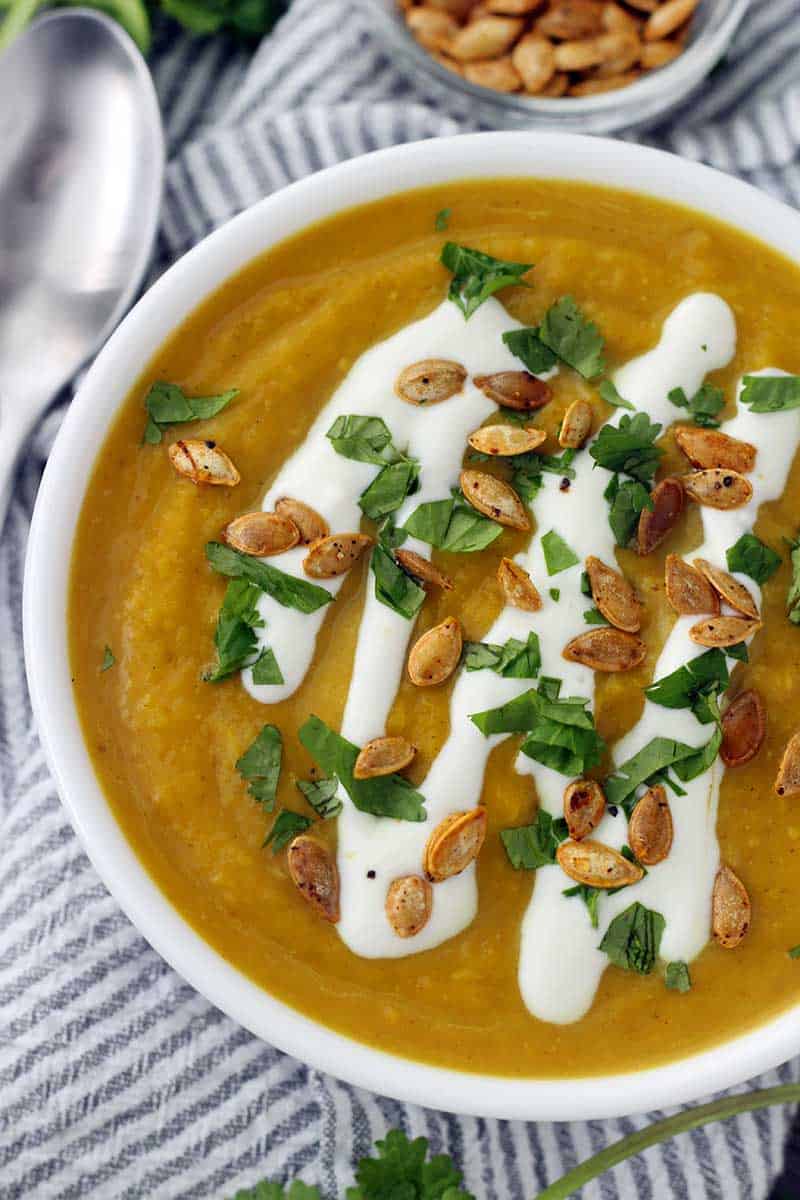 This slow cooker butternut squash soup is packed with flavor from curry, ginger, and other spices like turmeric. It's vegan, super creamy, and paleo/whole30 compliant!