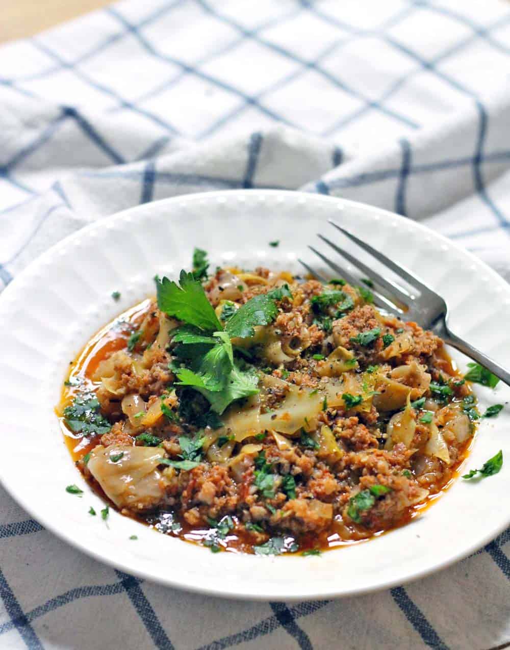 Spicy Slow Cooker Stuffed Cabbage Casserole | Tastes just like stuffed cabbage, but SO MUCH SIMPLER to make! Just mix in your slow cooker and turn on. Plus, it's Whole30 and Paleo approved!