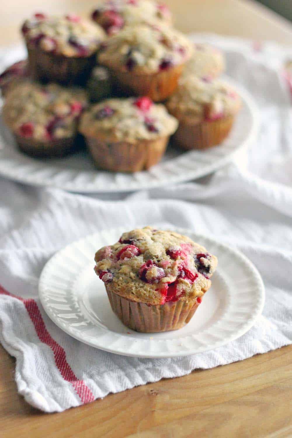 These whole wheat cranberry ginger pecan muffins are healthy, hearty, and oh so tasty! Perfect for Christmas morning, using the leftover fresh cranberries from Thanksgiving you have stored in your freezer!