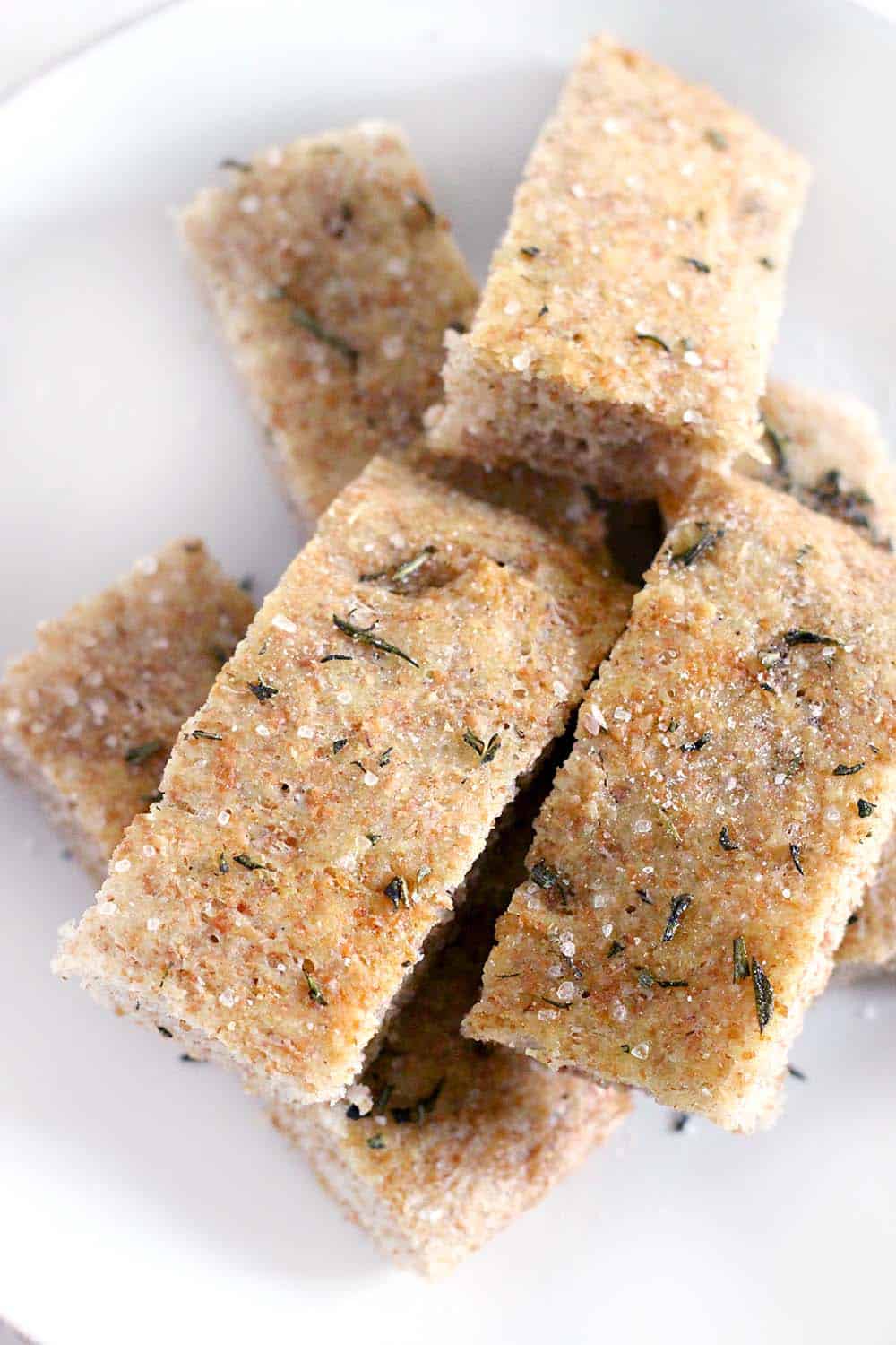 This whole wheat no knead focaccia with rosemary and sea salt is so delicious and easy to make, you'll never need to go to the bakery again!