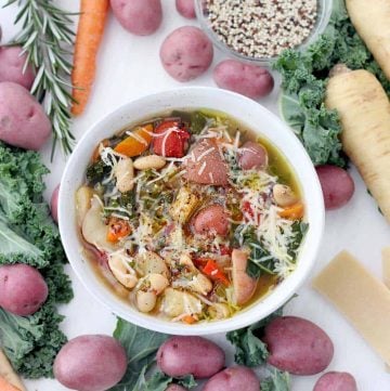 This Winter Minestrone Soup is packed with seasonal root vegetables like potatoes, parsnips, cabbage, and kale, as well as healthy quinoa and beans. Topped with plenty of extra-virgin olive oil and parmesan cheese, it's a delicious, hearty recipe to keep you warm this winter! Stovetop, Slow Cooker, and Instant Pot friendly.